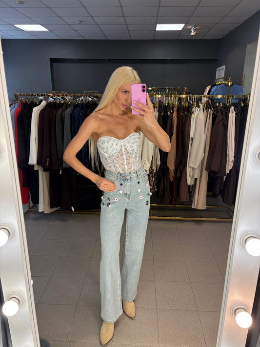 Džinsai dekoruoti gėlėmis